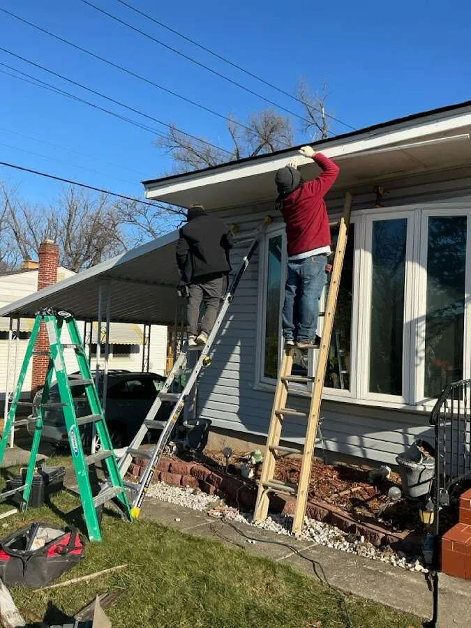 Restoration crew performing exterior repair in Covington