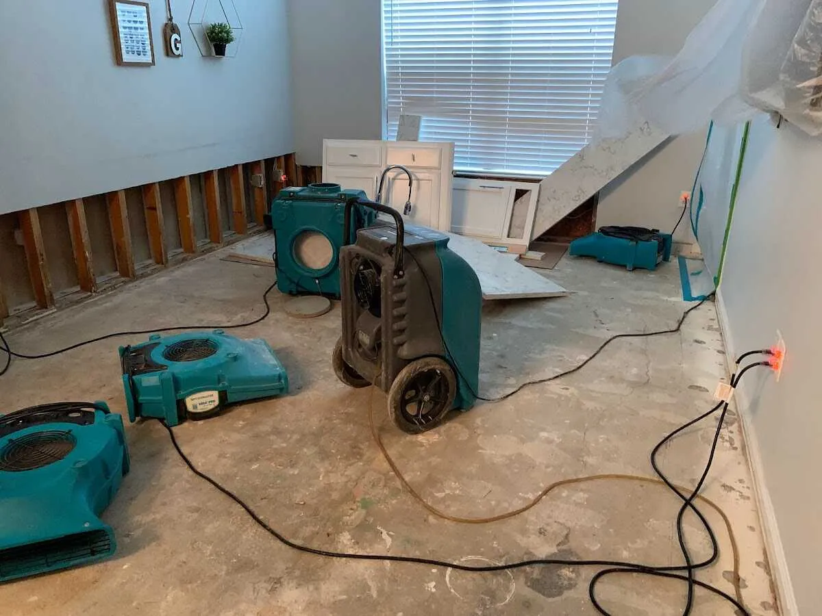 Dehumidifier in flood-cut room for Water Damage Restoration in Covington